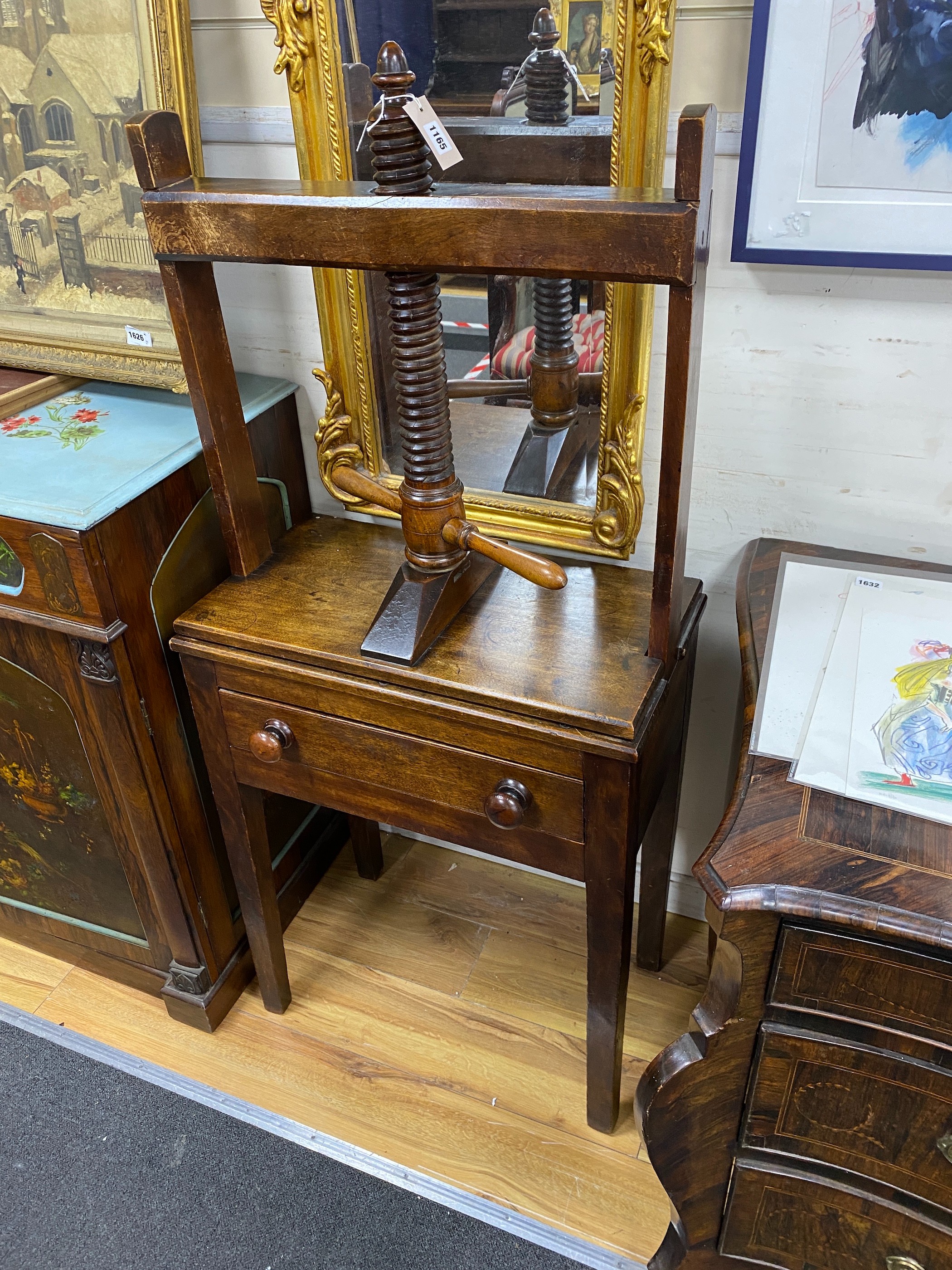 An early 19th century provincial mahogany press, with drawer, width 64cm, depth 35cm, height 139cm